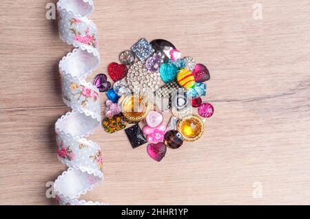 multi-colored sewn stones on a grey background.Copy Space Stock Photo