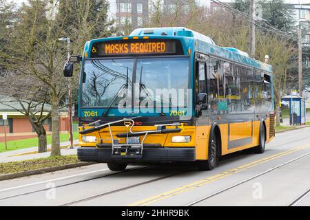 Seattle - January 22, 2022; Diesel electric hybrid King County Metro bus number 7061 on East Yesler Way in Seattle with electronic display Stock Photo