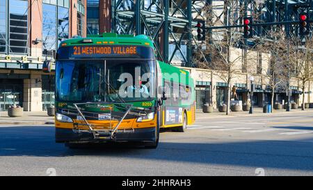 Seattle - January 22, 2022; Articulated metro bus in Seattle turning a corner,  The public transportation is on route 24 to Westwood Village Stock Photo