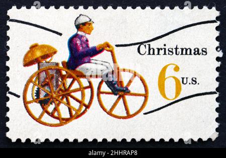 UNITED STATES OF AMERICA - CIRCA 1970: a stamp printed in the USA shows Mechanical Tricycle, Toy, Christmas, circa 1970 Stock Photo