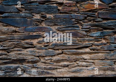 Stone and clay wall texture. Stone background with clay. Stock Photo
