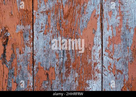 Texture of wooden boards with very worn brown paint. Wood background with chipped paint. Stock Photo