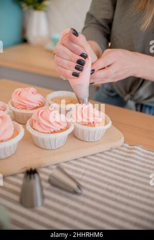 beautiful pink cakes on the table, on a stand, on the table Stock Photo