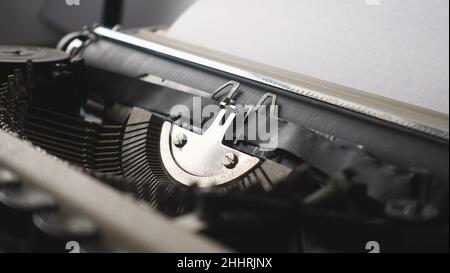 An author working on an old retro mechanical typewriter Stock Photo