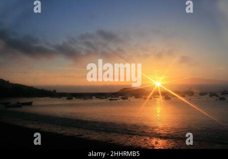 A soft focus image of a sunset over Town beach,Hugh Town,St Mary's the Isles of Scilly. Stock Photo