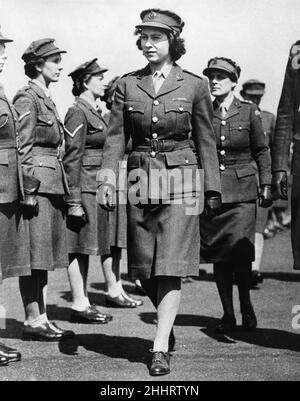 Queen Elizabeth II. Princess Elizabeth as Junior Commander in the ATS inspecting The Motor Transport Training Centre at Camberley, Surrey during the Second World War. Circa May 1945. Stock Photo