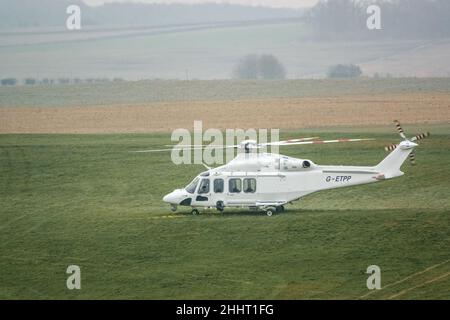 G-ETPP ETPS Agusta AW139 helicopter lands on grass on a pilot training flight exercise Stock Photo