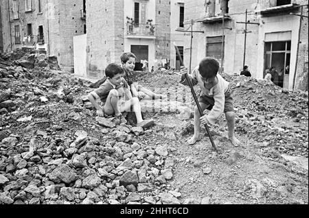 Scenes in Naples, southern Italy showing local children playing games in the street. Circa 1955. Stock Photo