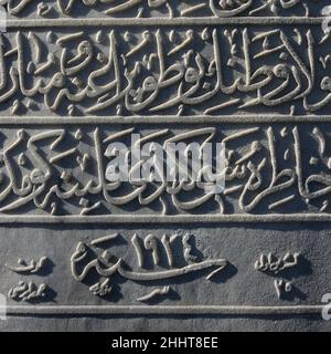 inscription in Arabic calligraphy carved on white stone in Istanbul Stock Photo