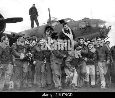 US troops in England during the Second World War Captain Bender of California celebrates with crew members of the US Eighth Air Force  after finishing his 25th operation  March 1944