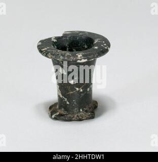 Small Ointment Vase (model?) ca. 2000-1640 B. C. Middle Kingdom ? This miniature vessel imitates the shape of an ointment jar of Dynasty 6. It was found with other small vessels (44.4.1-.3) and the figure of a woman (11.151.745) in a basket (called "toilet basket I" by the excavators) west of the pyramid of Amenemhat I at Lisht North where the basket - like another one ("toilet basket II;" see 44.4.4 and 07.228.19) - was deposited by itself and without a body. The majority of the objects in the group are dated to the late Middle Kingdom. The late Old Kingdom shape of this piece (compare 12.182 Stock Photo