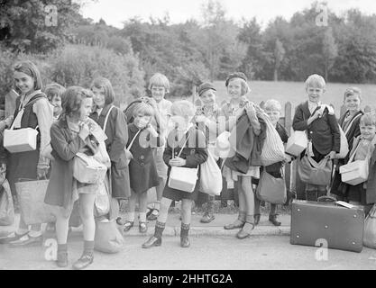 Evacuations of civilians in Britain during World War II was designed to save the population of urban or military areas from German aerial bombing of cities and military targets such as docks. Children, were moved to rural areas thought to be less at risk. Operation Pied Piper started on the 1st September and  went on to the 3rd September 1939. More than 1.5 million people were evacuated. Further waves of official evacuation and re-evacuation occurred from the south and east coast in June 1940, when a seaborne invasion was expected, and from affected cities after the Blitz began in September 19 Stock Photo