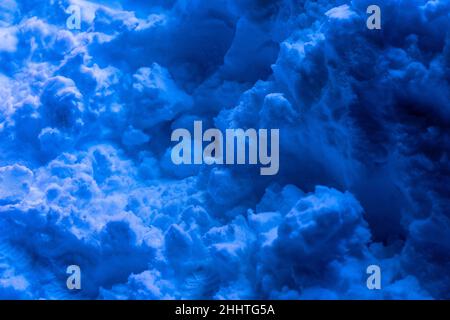 Snow surface. Fresh fluffy snow texture. Blue light luminance Stock Photo
