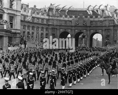 Five Companies of Foot Guards  part of Her Majesty Procession make their way through Admiralty Arch as they escort the Queen's coach to Westminster Abbey for her Coronation. 2nd June 1953 Stock Photo