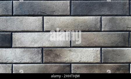Abstract brown gray brick wall texture for wallpaper design, loft style. Stock Photo