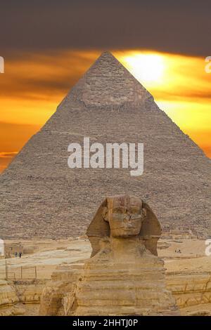 Sphinx sculpture and the Cheops pyramid in Giza in Egypt Stock Photo