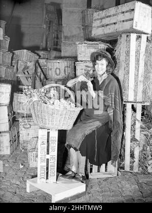 Filming of Pygmalion, directed by Anthony Asquith and Leslie Howard, at at Pinewood Studios, London, England, 20th March 1938. Actress, Wendy Hiller as the flower girl. Stock Photo