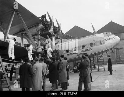 Ground crew seen here applying 'Killfrost' anti icing agent to the wings of the Imperial Airways Handley Page H.P.45 aircraft Horatius (G-AAXD) prior to its flight from London Croydon Airport to Paris. 23rd November 1937