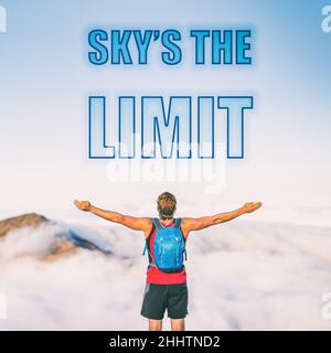 SKY'S THE LIMIT motivation text written on sky background. The sky is the limit for your success. Man with open arms inspirational picture for Stock Photo
