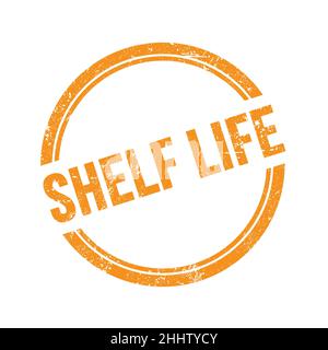 SHELF LIFE text written on orange grungy vintage round stamp. Stock Photo