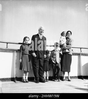 Charlie Chaplin with family: Wife Oona, son Michael John Chaplin 6 1/2, and daughters Geraldine Leigh Chaplin 8, Josephine Hannah Chaplin 3 1/2 and Victoria Chaplin 16 Months.Seen here aboard a ship arriving for their visit to the United Kingdom.  23rd September 1952. Stock Photo
