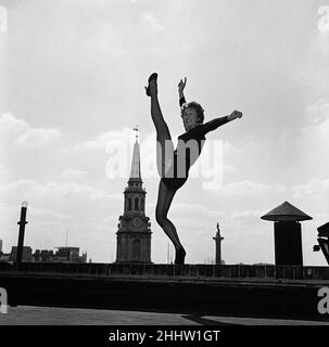 Dancer Gillian Lynne, the lead solo dancer of a new American musical Can Can which is opening at the Stoll Theatre, practising her routine on a rooftop. 7th September 1954. Stock Photo