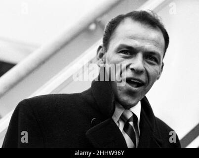 Singer Frank Sinatra about to board a TWA flight to New York at London Airport . Circa December 1952 Stock Photo