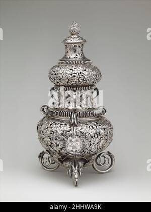 Incense burner ca. 1675 T L British Scent was an important feature of grand European households in the seventeenth and eighteenth centuries. Foul-smelling air was associated with the spread of disease, so scented waters, fresh flowers, pot-pourris, and perfume burners were used to improve the atmosphere. A perfume burner like this one emitted the smoke of a pastille made from ingredients like rosewater, myrtle, and orange, which burned gently over a charcoal fire.. Incense burner  205007 Stock Photo