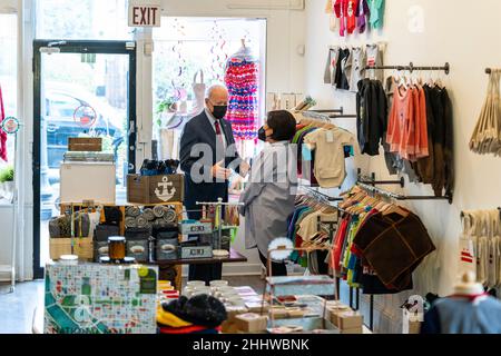 Washington, United States Of America. 26th Jan, 2022. Washington, United States of America. 25 January, 2022. U.S President Joe Biden chats with Viboonrattana Moo Honey, owner of Honey Made store during a walking tour of small businesses, January 25, 2022 in Washington, DC Credit: Adam Schultz/White House Photo/Alamy Live News Stock Photo