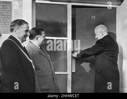 Kirkby, a town in the Metropolitan Borough of Knowsley, Merseyside, England. Our picture shows, Alderman Sir Alfred Shennan opening the 1000th house on the Kirkby Estate, on the left are the Lord Mayor of Liverpool, Alderman W J Tristram,  and Dr R Bradbury, City Architect and Director of Housing, 29th October 1953. Stock Photo
