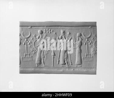 Stamp-cylinder seal with cultic scene ca. 8th century B.C. Assyro-Babylonian. Stamp-cylinder seal with cultic scene. Assyro-Babylonian. ca. 8th century B.C.. Banded red and beige Siltstone. Neo-Assyrian / Neo-Babylonian. Mesopotamia Stock Photo