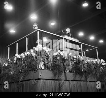 American evangelist Billy Graham addressing a huge crowd of people at Kelvin Hall in Glasgow, Scotland during his Scottish Crusade. 23rd March 1955. Stock Photo