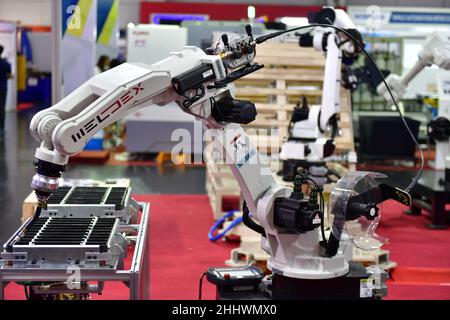BANGKOK - June 22,19 :MANUFACTURING EXPO 2019 (ME 2019) at BITEC Bangna hall.Modern high quality automation welding white robots arm  industrial Stock Photo