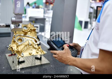 Coordinate measuring machine (CMM) 3d measurement technologies to check the validity of the engine block for industrial manufacturing Stock Photo