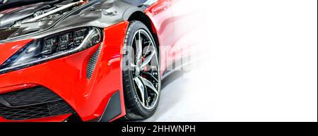 Close up Front headlights of red modify car white background Stock Photo