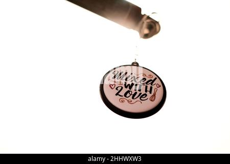 Accessories round keychain with "Mixed with Love" inscription Stock Photo
