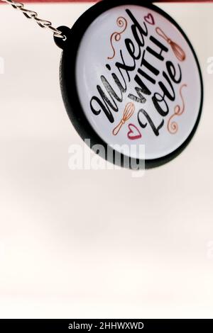 Accessories round keychain with "Mixed with Love" inscription Stock Photo