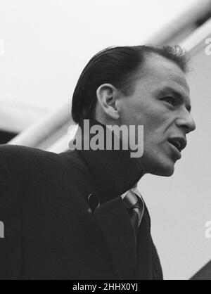 Singer Frank Sinatra seen here about to board a TWA flight to New York at London Airport . Circa December 1952 Stock Photo