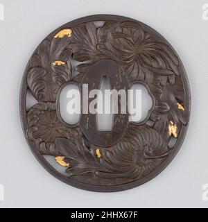 Sword Guard (Tsuba) early 19th century Japanese A tsuba is a sword guard and part of a sword mounting. It is mounted between the sword’s blade and grip to protect the user’s hands.. Sword Guard (Tsuba)  29946 Stock Photo