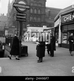 For a week, owing to a trade dispute, Londoners have been without newspapers. This news vendor at Kings Cross station, did brisk business however in threepenny sheets containing football pool results and racing programmes. 1st April 1955. Stock Photo