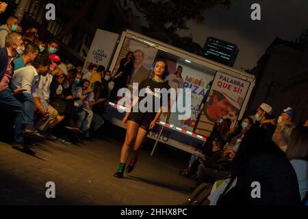 Bogota, Colombia. 25th Jan, 2022. Models with clothes alusive to Colombia daily politician topics model in downtown Bogota at the door of the Jorge Eliecer Gaitan Theatre in Bogota, Colombia on January 25, 2022. Credit: Long Visual Press/Alamy Live News Stock Photo