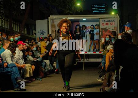 Bogota, Colombia. 25th Jan, 2022. Models with clothes alusive to Colombia daily politician topics model in downtown Bogota at the door of the Jorge Eliecer Gaitan Theatre in Bogota, Colombia on January 25, 2022. Credit: Long Visual Press/Alamy Live News Stock Photo