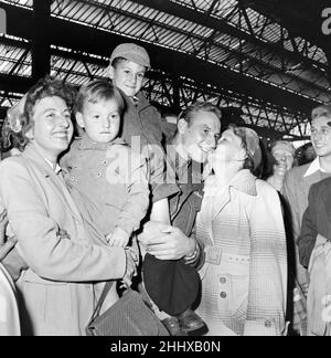 British Prisoners of war released from Korea, pictured on their return to Southampton where they docked from the Asturius. Corporal Upjohn of the Gloucester regiment is greeted by his family at the sheds in Southampton. 16th September 1953. Stock Photo