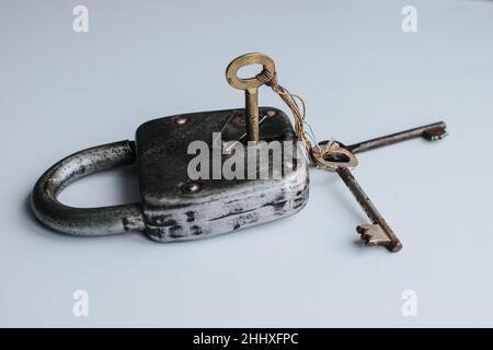 Vintage lock with three keys Stock Photo