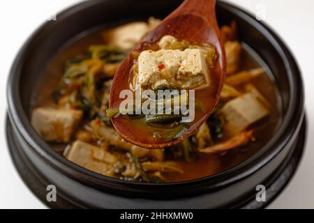 Soybean paste stew with shepherd's purse and crab on a white background Stock Photo