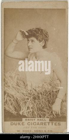 Daisy Hall, from the Actors and Actresses series (N145-7) issued by Duke Sons & Co. to promote Duke Cigarettes 1880s Issued by W. Duke, Sons & Co. Trade cards from the set 'Actors and Actresses' (N145-7), issued in the 1880s by W. Duke Sons & Co. to promote Duke Cigarettes. There are eight subsets of the N145 series. Various subsets sport different card designs and also promote different tobacco brands represented by W. Duke Sons & Company. This card is from the seventh subset, N145-7. Note that actors' names are spelled differently on cards throughout set and are not dependable for accuracy.. Stock Photo