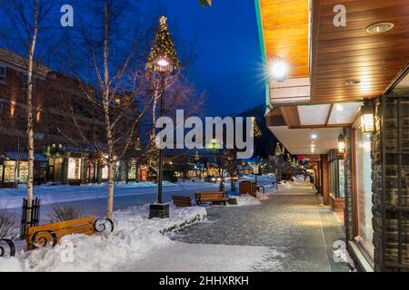 Town of Banff, Alberta, Canada - January 10 2022 : Downtown Banff Avenue in winter night. Stock Photo