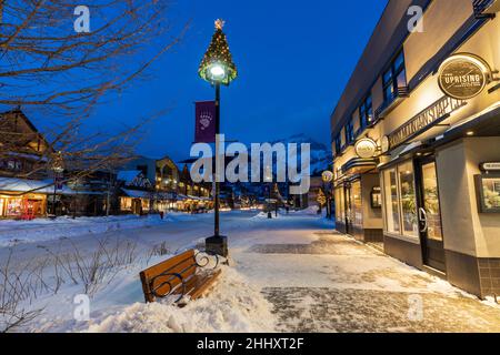 Town of Banff, Alberta, Canada - January 10 2022 : Downtown Banff Avenue in winter night. Stock Photo