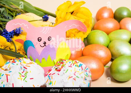 Beautiful Easter card with rabbit paper craft, eggs and cakes Stock Photo