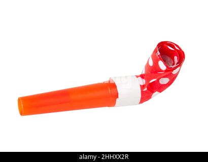 Rolled orange festive noisemaker or party whistle horn on the white isolated Stock Photo